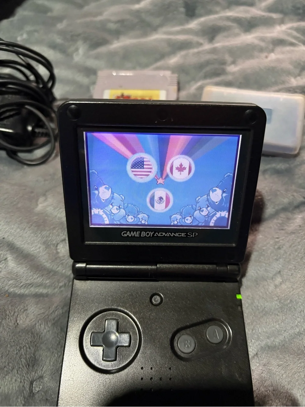 Nintendo Game Boy Advance SP Black with Pokémon sapphire, Zelda, Care Bears